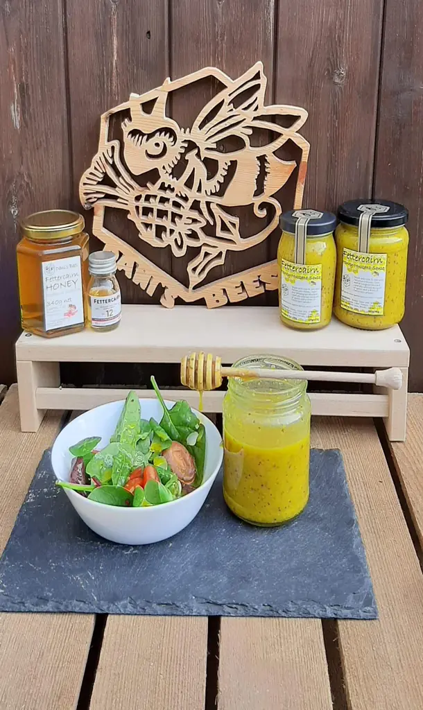 Various jars of honey as a dressing for a salad